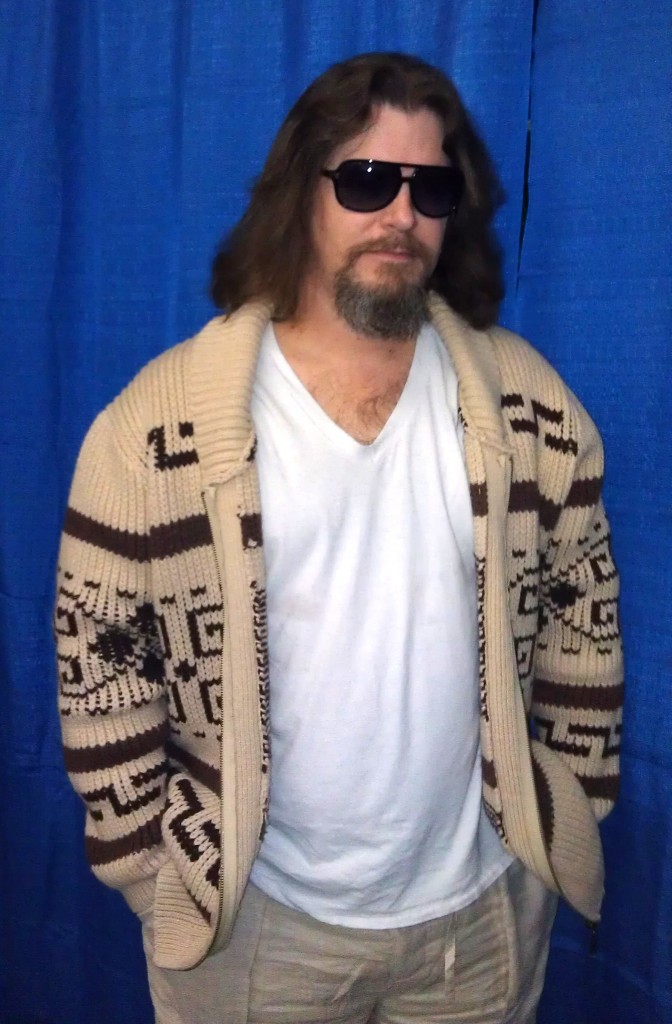 Person in sunglasses with patterned cardigan