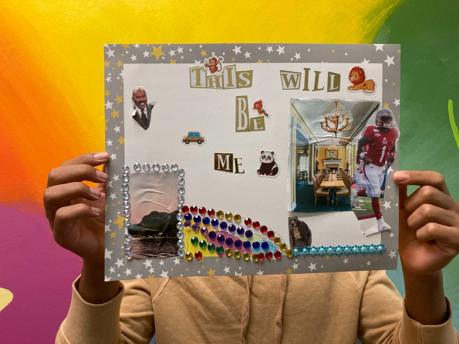 Person presenting a personalized collage board